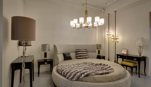 Exclusive Home Interiors - New York, NY. Round bed by Inedito with Officina Luce chandelier above