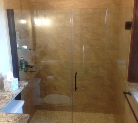 Dawson Contracting Inc - Marshall, MO. Custom curbless showers- no step. Glass shower door.