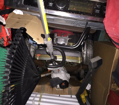 VIP Relocation - Houston, TX. lawnmower thrown on top of Stainless steel oven