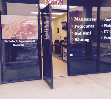 Min's Nails. Min's located next to Harbor Freight Tools on SR520.