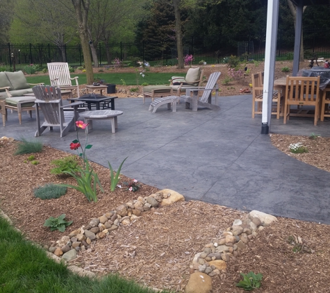 Classic Concrete Raising Inc. - Cedar Rapids, IA. Landscaped stamped colored patio project