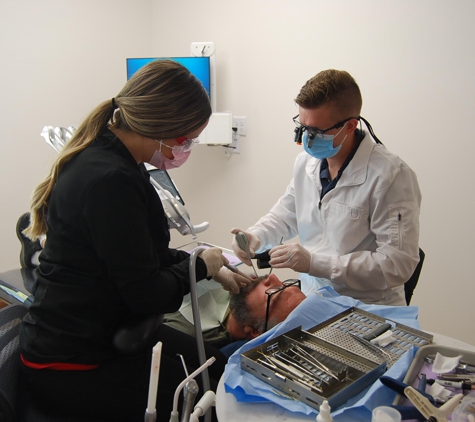 Family Dental Center: Scott R. Gardner, DDS - Nampa, ID. Nampa dentist Dr. Gardner performing root canal procedure at Family Dental Center