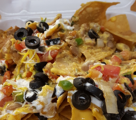Xochimilco Authentic Mexican Restaurant - Sacramento, CA. Super nachos with chicken from a farmers' market booth.