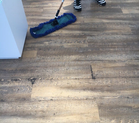 Letts cleaning service - Williamsburg, VA. The glue was coming out the floor between the cracks