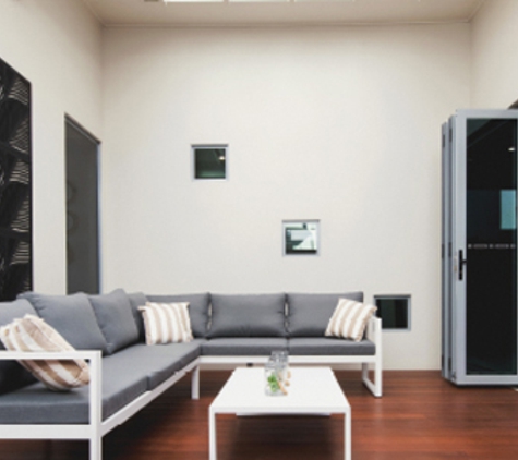 Bradnam's Windows & Doors - Bungalow, QLD. Ultra Silver Aluminium Bi-Fold Door With Grey Glass