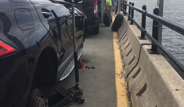 Quick Fix Mobile Tire Repair - Brooklyn, NY. Changing 2 tires on a Mercedes SUV at the Heliport in lower Manhatten