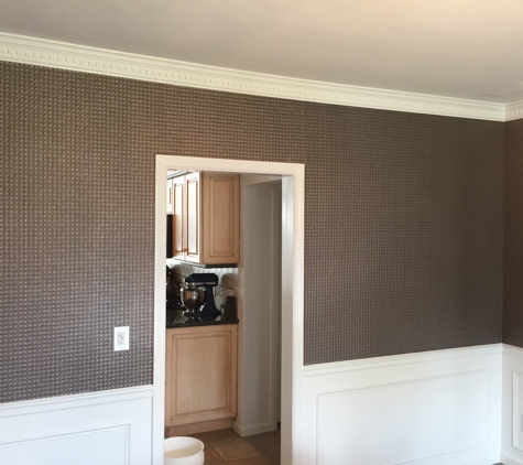 United Painting of Long Island, Inc. - Mineola, NY. High end wallpaper matrial hung on the wall 