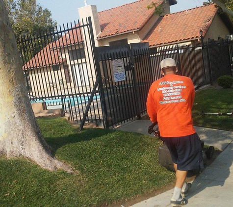 JGS Irrigation & Landscape Services - Lancaster, CA. Using a small mower around the pool area at Kingtree Park Townhomes