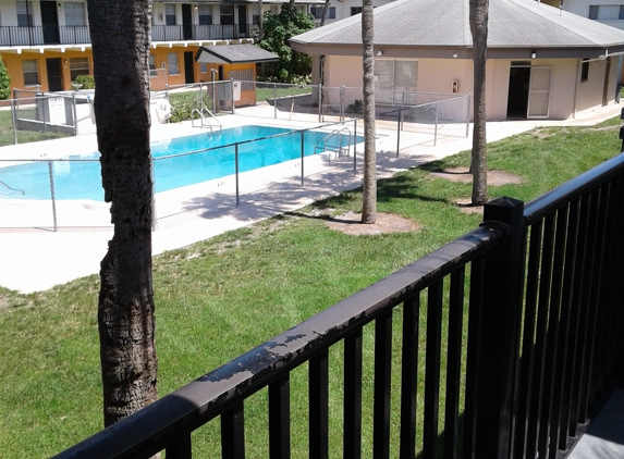 The Village Green Apartments - Cocoa, FL. Clubhouse, pool and apartments