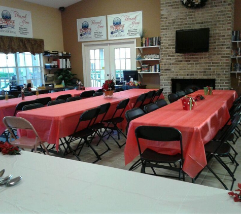 Carter's Family Rent-All - Daytona Beach, FL. 8ft Tables and black chairs