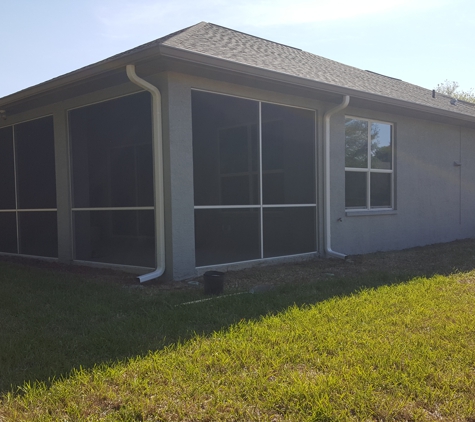 Paramount Seamless Gutters - Beverly Hills, FL. Corner and right side showing neatly placed downspouts.