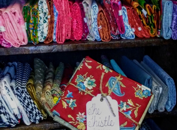 The Thistle Quilt Shop and Fabric Store - Pierce City, MO. Many fat quarters of fabric available.