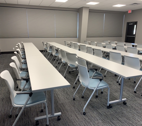 More Decor Design Inc - Tulsa, OK. Cellular shades provide excellent privacy and light control in this conference room.