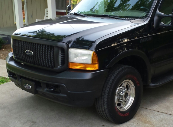 Xtreme Measures by Design - North Wilkesboro, NC. Ford Excursion Totally Boss. Window Tint by XMD , Sound Ordnance 1000 watts x 2 12" Subs with Bandpass, Setting on 33x10.50s, Triton V10.