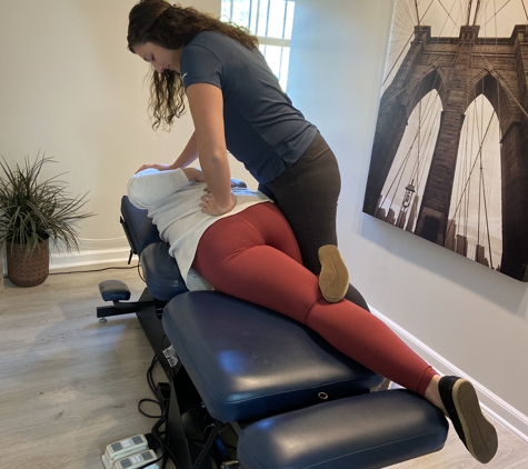 Seven Bridges Chiropractic - Jacksonville, FL. Adjustment being performed on a patient