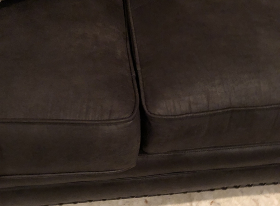 Gallery Furniture - Houston, TX. Seat cushion issue in other end of couch.