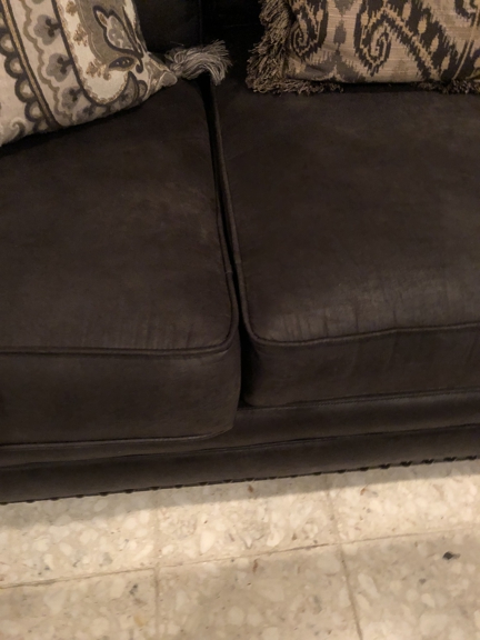 Gallery Furniture - Houston, TX. Seat cushion issue in other end of couch.