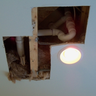 Chesapeake Plumbing Incorporated - Pasadena, MD. Hole cut in ruined ceiling after they refused to fix leaky tub.