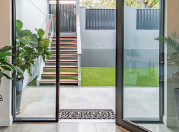 Bradnam's Windows & Doors - Mount St John, QLD. Black Aluminium Hinged Door