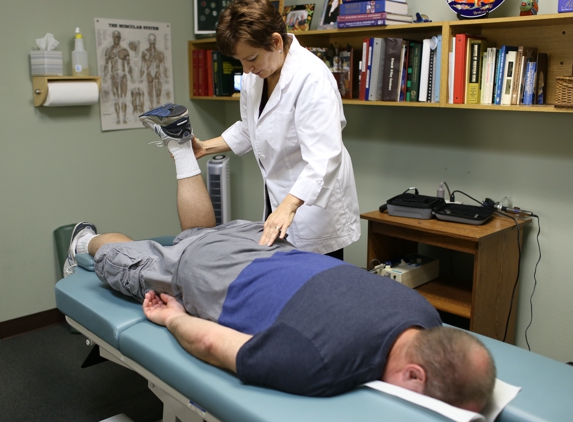 Rosenthal Chiropractic Clinic - Largo, FL. Dr. Marcy checking a patient