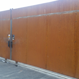 Building Block Masonry - Phoenix, AZ. 30 ft wide and 8 ft tall custom industrial metal gate