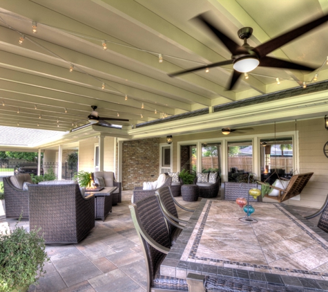 ABC Home Improvements - Baton Rouge, LA. Stone patio with ceiling fans and comfortable outdoor seating | Custom Patio Cover Arbor in Baton Rouge - www.lasunrooms.com