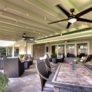 ABC Home Improvements - Baton Rouge, LA. Stone patio with ceiling fans and comfortable outdoor seating | Custom Patio Cover Arbor in Baton Rouge - www.lasunrooms.com