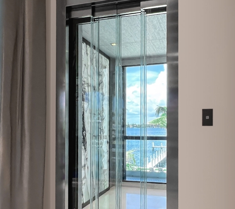 Southeast Elevator Inc - Fort Pierce, FL. 2-speed glass doors and a window