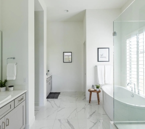 Builders Flooring & Design LLC - Chandler, AZ. White and breezy marble look bathroom remodel.