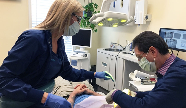 The Silberman Dental Group - Waldorf, MD. Waldorf dentist Dr. Paul B Silberman and his dental assistant working with a patient at The Silberman Dental Group