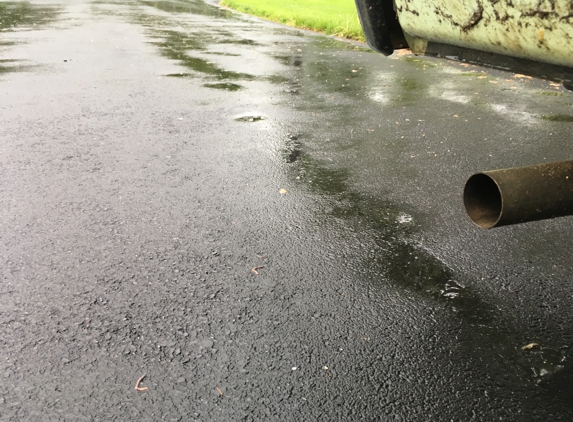 Affordable Paving - Lititz, PA. Everywhere there is water is an indent from a parked car. It gets worse every day