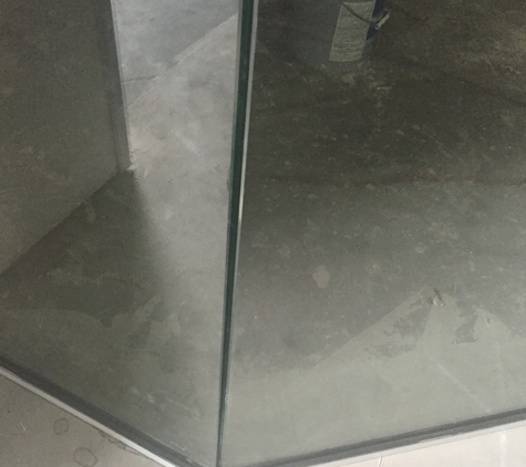 Mr. Glass & Mirror - Houston, TX. Glass not flush can see between the seems