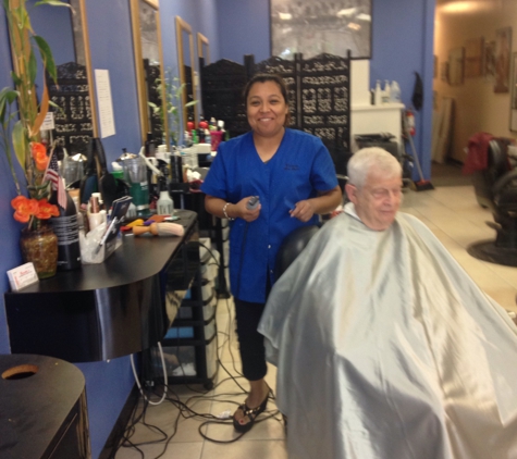 Rosetta's Barbershop & Salon - boynton beach, FL. Victrola working on another great haircut.