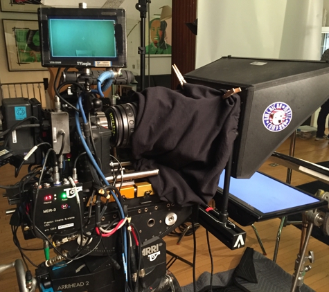 Teleprompterrental.com - New York, NY. New Interrotron Mark IV.  Has invisible in ear speaker so talent sees the director's face and hears his/her voice from the same place.