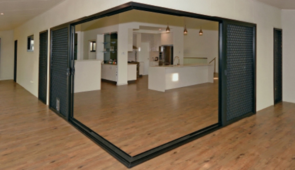 Bradnam's Windows & Doors - Mount St John, QLD. Black Aluminium Corner Sliding Door