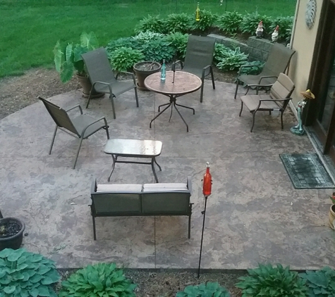 Classic Concrete Raising Inc. - Cedar Rapids, IA. Backyard landscaped, stamped colored patio project