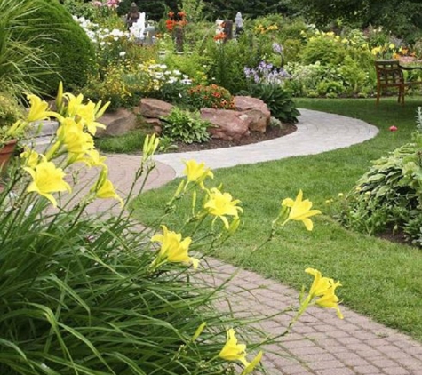 JGS Irrigation & Landscape Services - Lancaster, CA. Flowerbed and walkway with edged borders