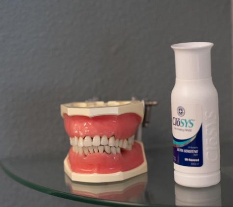 Radiant Family Dentistry - Scottsdale, AZ. Dental model and CloSYS sensitive mouthwash at Radiant Family Dentistry