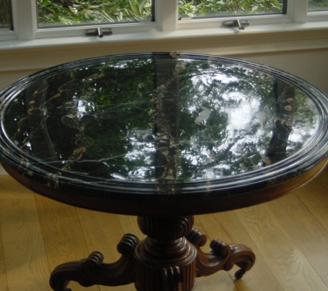 Da Vinci Stone Restoration - Branford, CT. This photo shows an antique Portoro marble table over 100 years old. Notice the extremely rich black color and brilliant gloss after restori