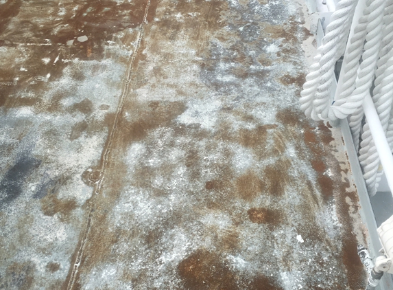 Wood Lawn Sandblasting - Mangonia Park, FL. How the decks of a yacht have looked 1 month into Alex doing work. Rusting away with no sign of finishing the job