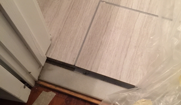 Ben Baker Flooring - Ozark, AL. Bathroom door not hung or flooring not finished