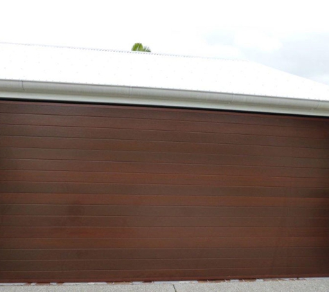 Noosa Door Centre. Tilt door fabricated from overhead sectional door panels in a frame.
