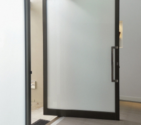 Bradnam's Windows & Doors - Carrum Downs, VIC. Black Aluminium Pivot Door With Obscure Glass
