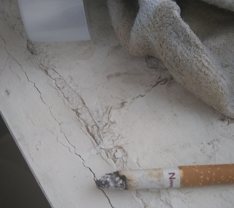 Reno Suites - Reno, NV. Someone left cig still lit in restroom.