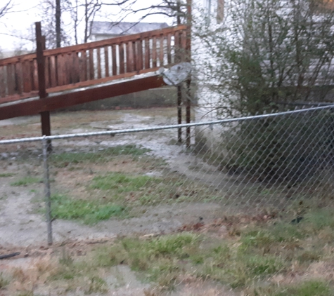 wm tucker excavating and landscaping - Dickson, TN. Water no longer sits along house.