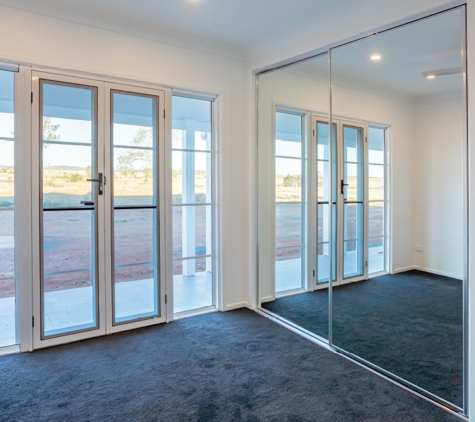 Bradnam's Windows & Doors - Kensington, QLD. Mirror Sliding Wardrobe Door
