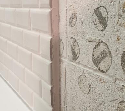 Only Floors - Edge Hill, QLD. Wall not prepared before tiling.