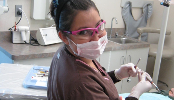 Dental Care of Spokane - Spokane, WA. Dental hygienist preparing patient for dental implants procedure at Dental Care of Spokane