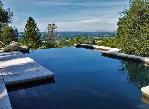 Jim Chandler Pools - Penryn, CA. Sacramento region expert pool builder, Jim Chandler Pools, showcasing an exquisite vanishing-edge pool with panoramic views in Auburn, CA!