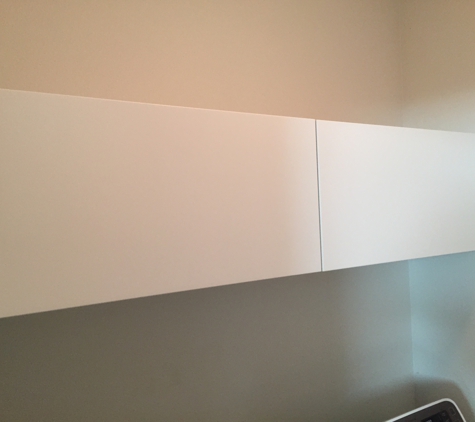 C.C.Assembly Services - Austin, TX. Laundry room installation of ikea overhead cabinets.